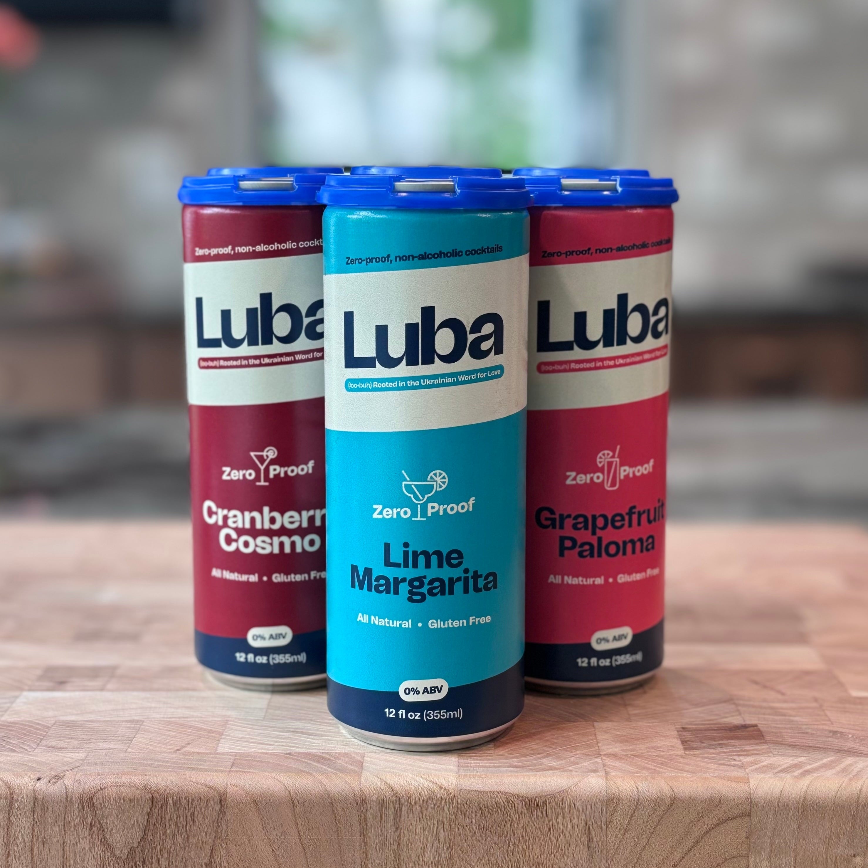 Luba Cranberry Cosmo, Lime Margarita, and Grapefruit Paloma cans in a variety pack